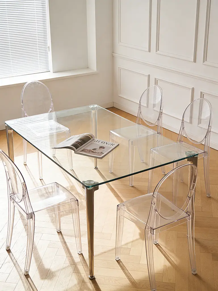 photography of contemporary minimalist dining space with transparent glass dining table