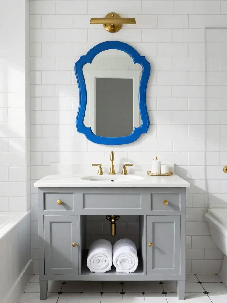 A crisp transitional bathroom with a tailored modern classic aesthetic, featuring a gray shaker-style vanity topped with a white quartz coun.