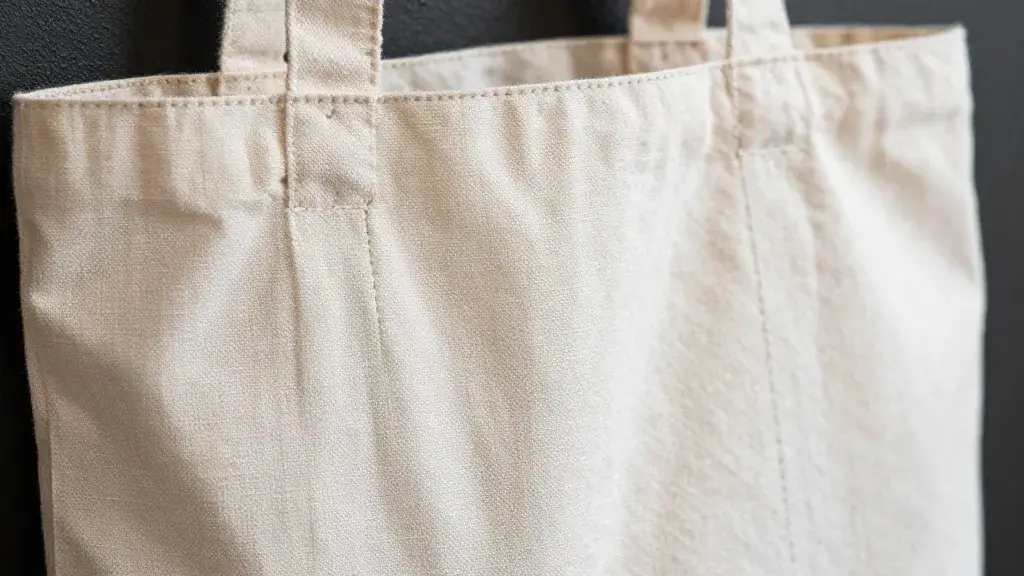 Focused shot of a cloth tote bag with visible stitching and texture